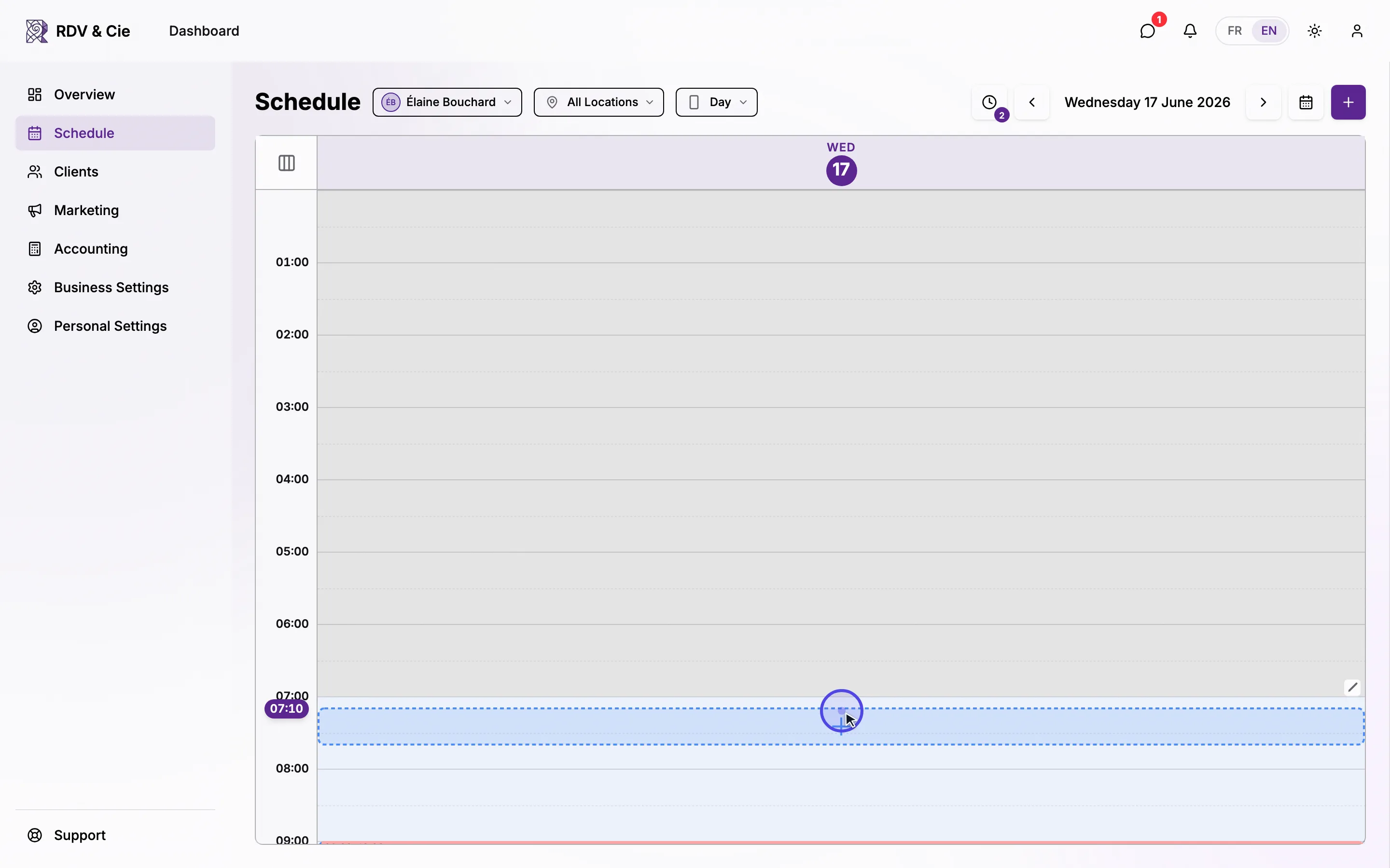 Pressing and holding an empty slot — the time indicator follows, then the Create Booking dialog opens at that time